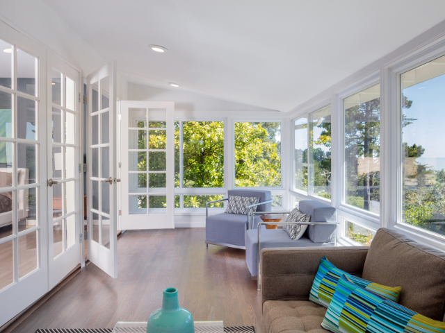 Beautiful sunroom home addition with large windows and natural light in Alpharetta