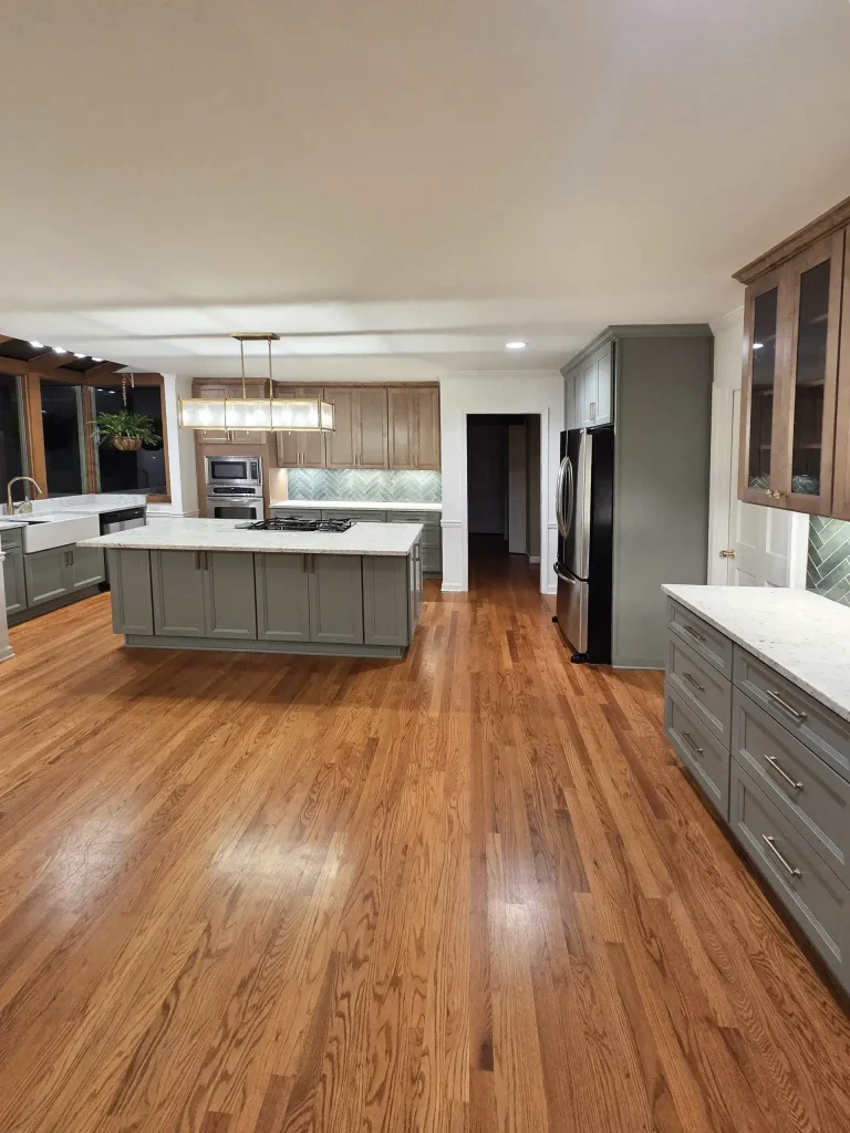 pacious custom kitchen remodel in North Atlanta featuring hardwood floors and a large center island.