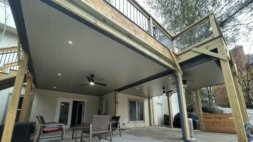 Waterproof under-deck ceiling system with recessed lighting and fans in Decatur.