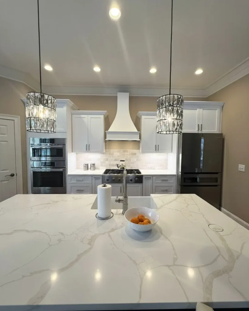 Kitchen remodel in Alpharetta, GA with quartz countertops and large island detail in open layout design