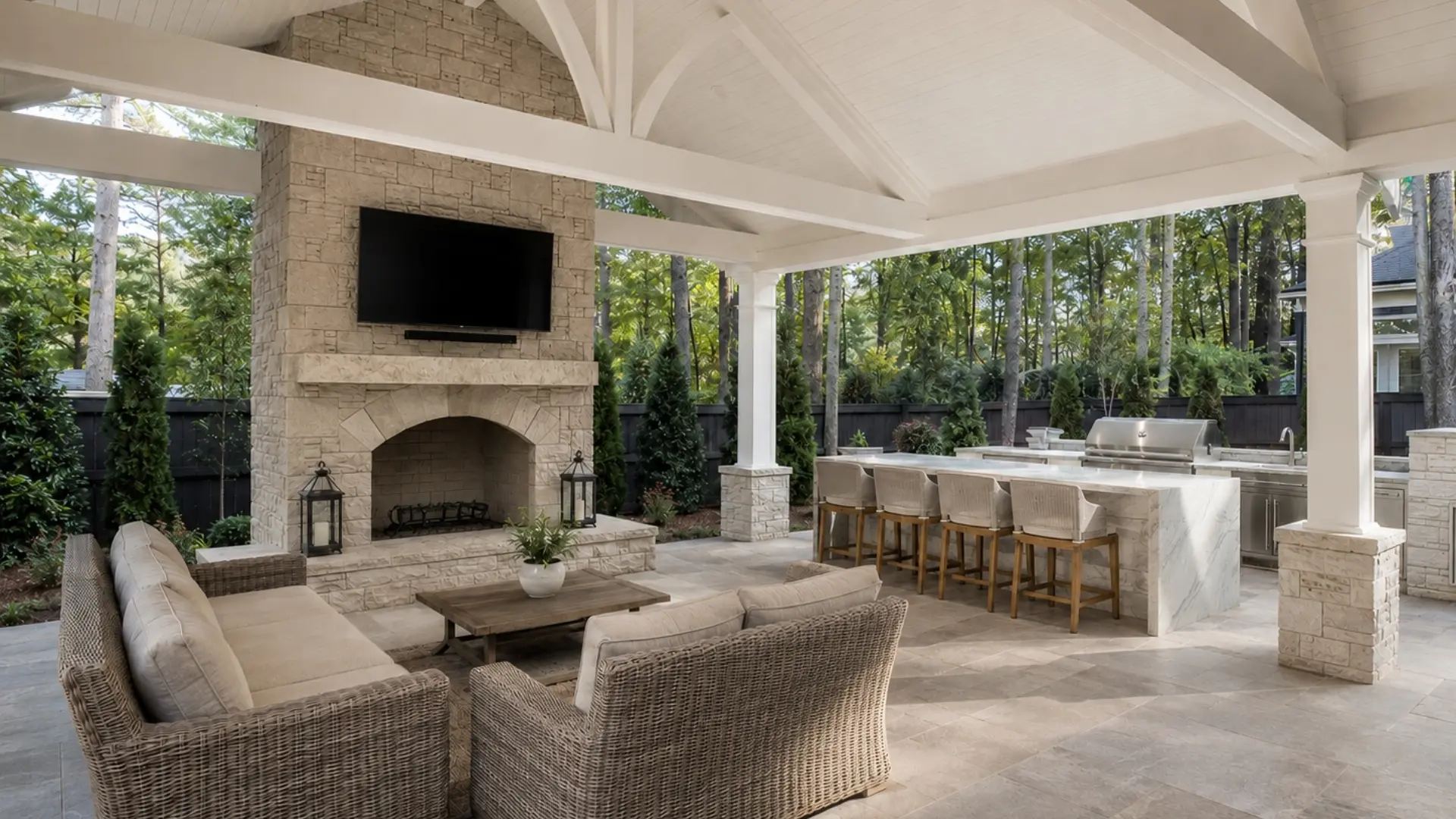 Luxury covered outdoor kitchen and fireplace patio design for North Atlanta backyard entertaining and outdoor living.