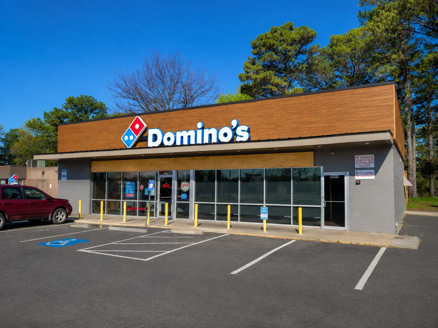After renovation exterior of Domino's restaurant showing the updated storefront, facade, and commercial improvements.