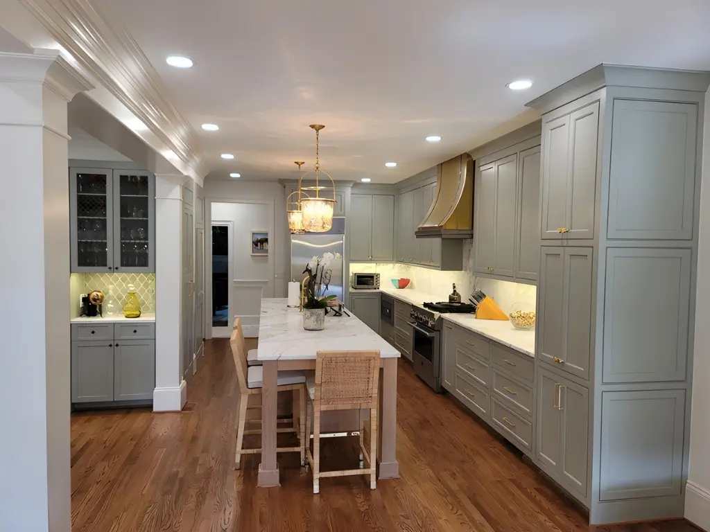 Custom kitchen remodel with gray cabinetry, large island, and hardwood floors