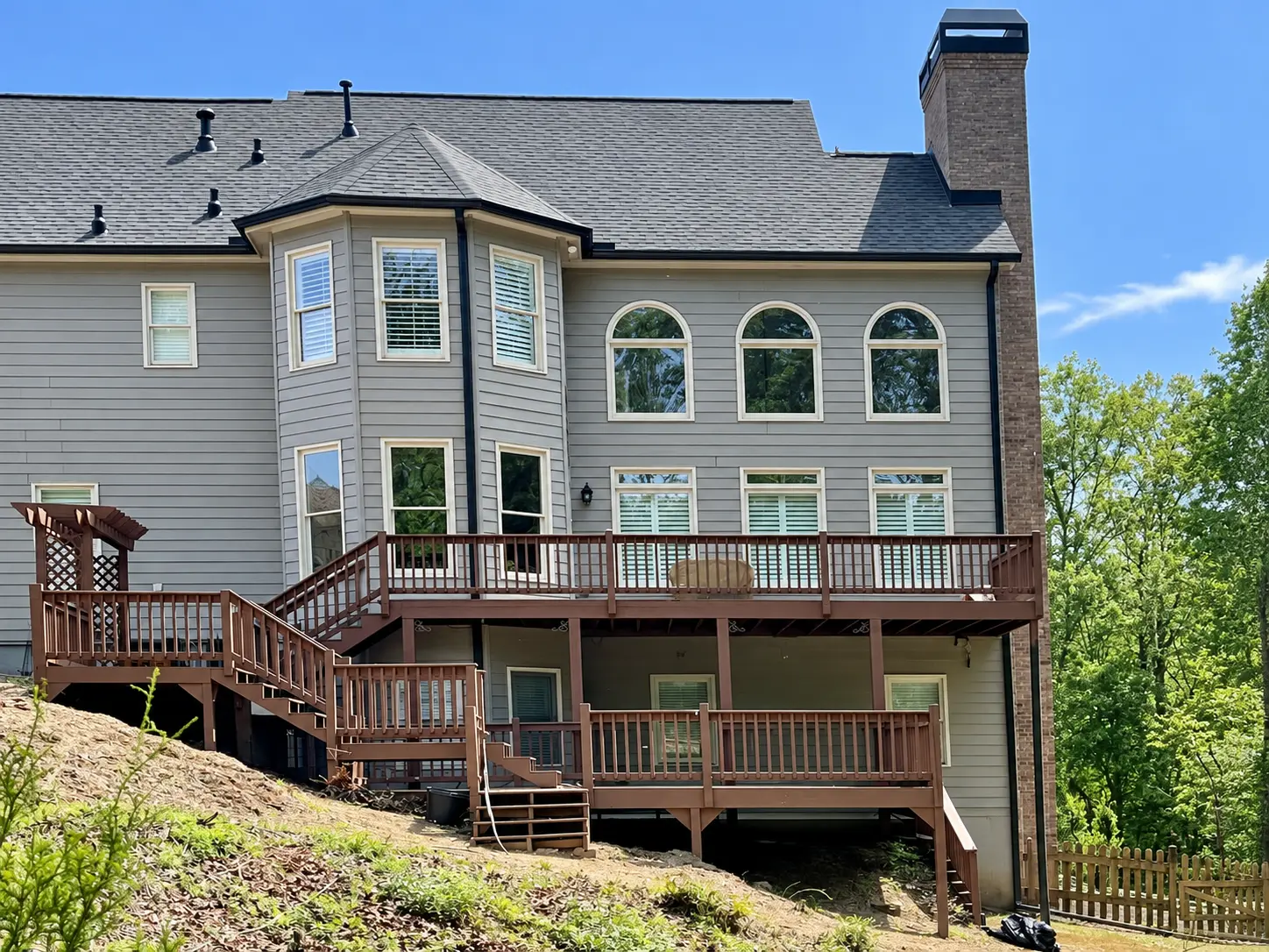 Before: Existing multi-level wood deck before reconstruction at a home in Milton, GA.