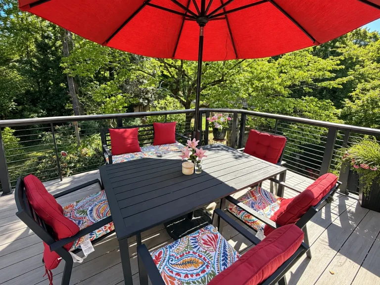 TimberTech Vintage Coastline deck with horizontal cable railing and outdoor dining area in Marietta, GA.