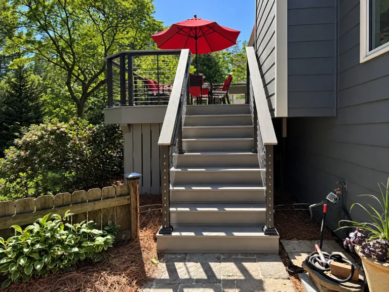 TimberTech PVC deck stairs with black horizontal cable railing in Marietta, GA.