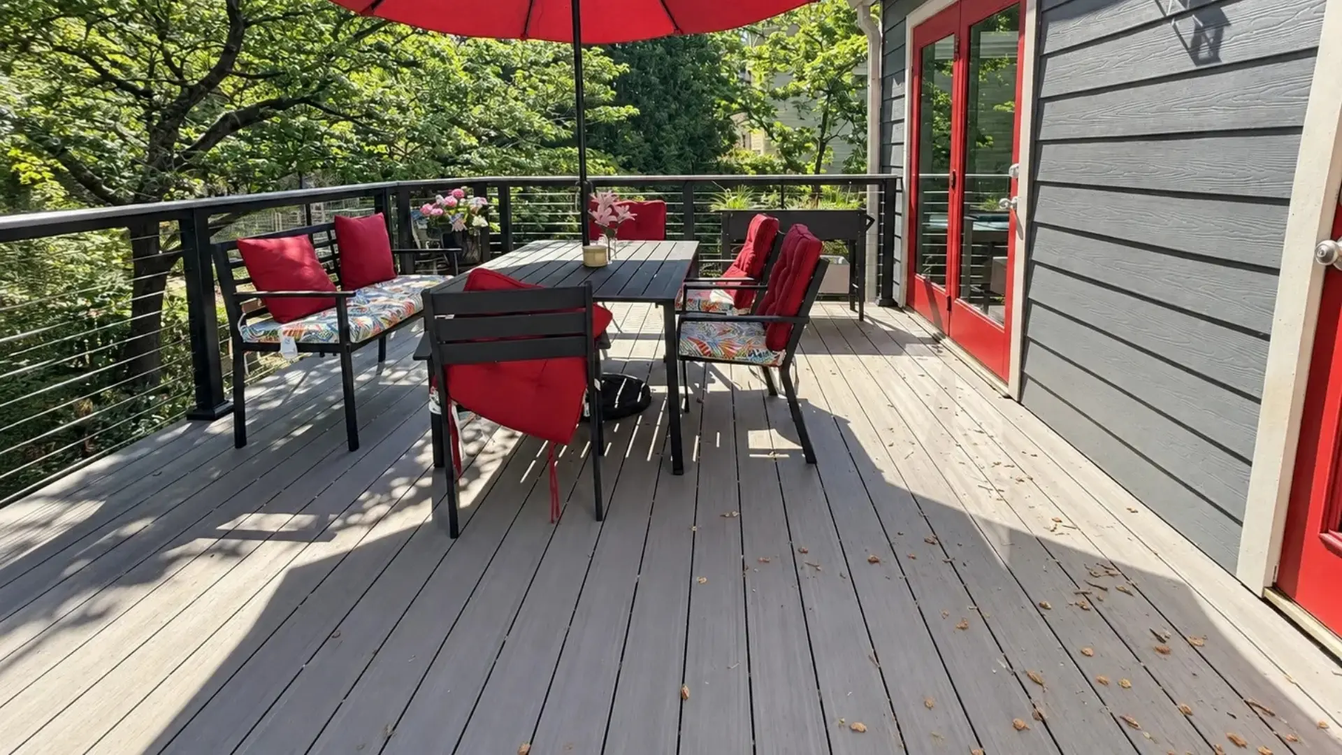 TimberTech Vintage Coastline PVC deck with horizontal cable railing and outdoor dining area in Marietta, GA.