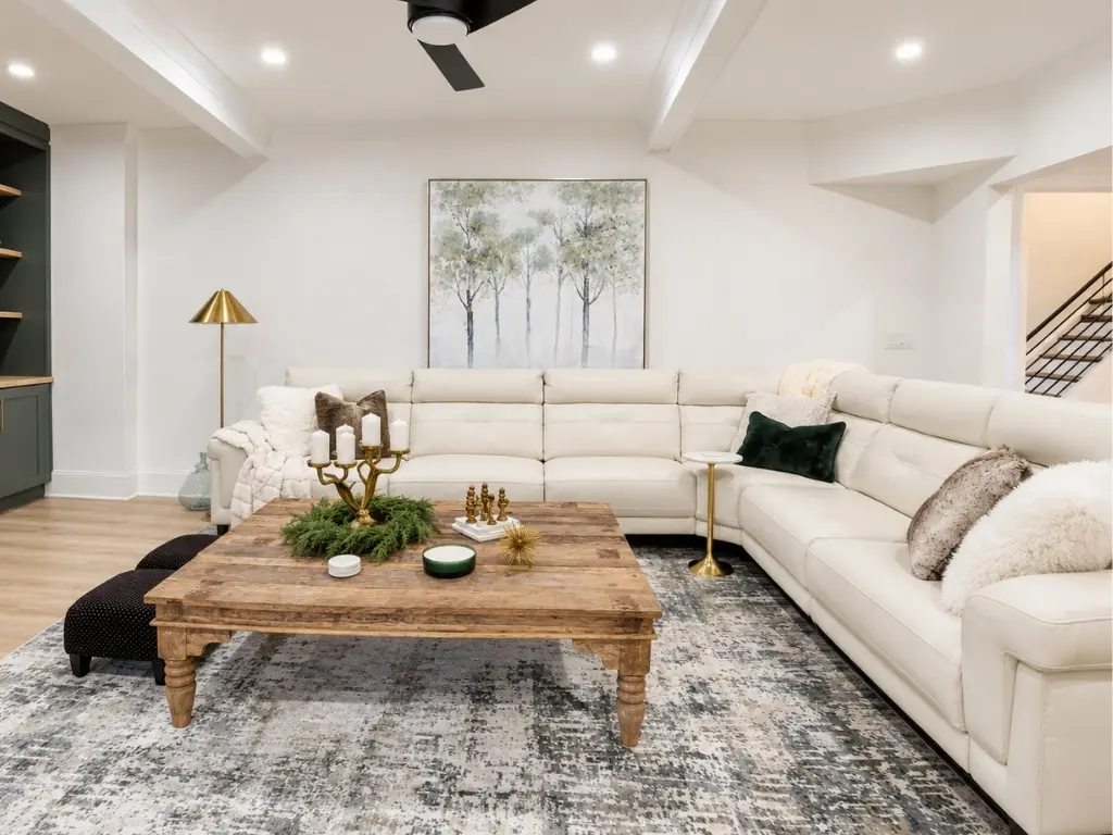 Modern basement remodeling project with spacious family room and sectional seating in Alpharetta, GA