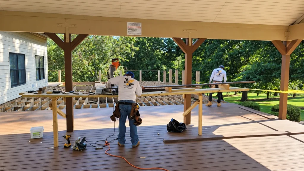 Yanover Construction crew installing composite decking and framing a custom covered deck in Alpharetta, GA.