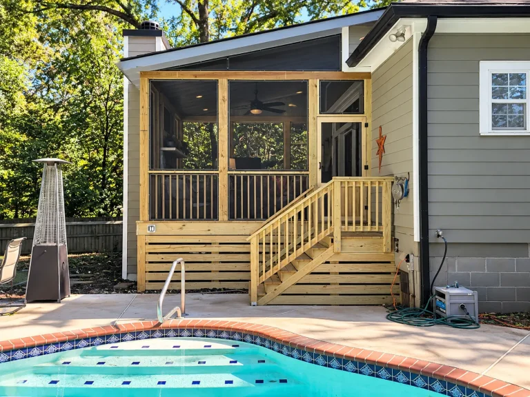 Traditional wood railings on an elevated screened porch.