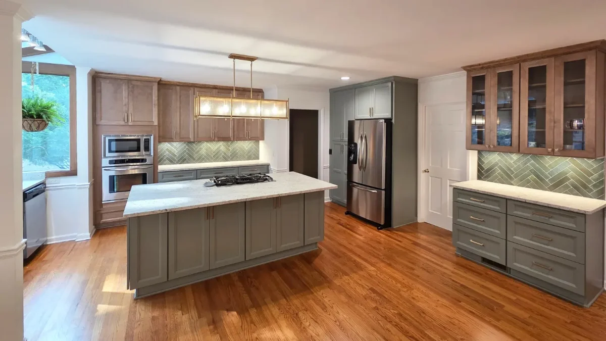 kitchen-renovations-alpharetta Custom kitchen remodel in Alpharetta, GA with large island, custom cabinetry, hardwood floors, and modern backsplash design.